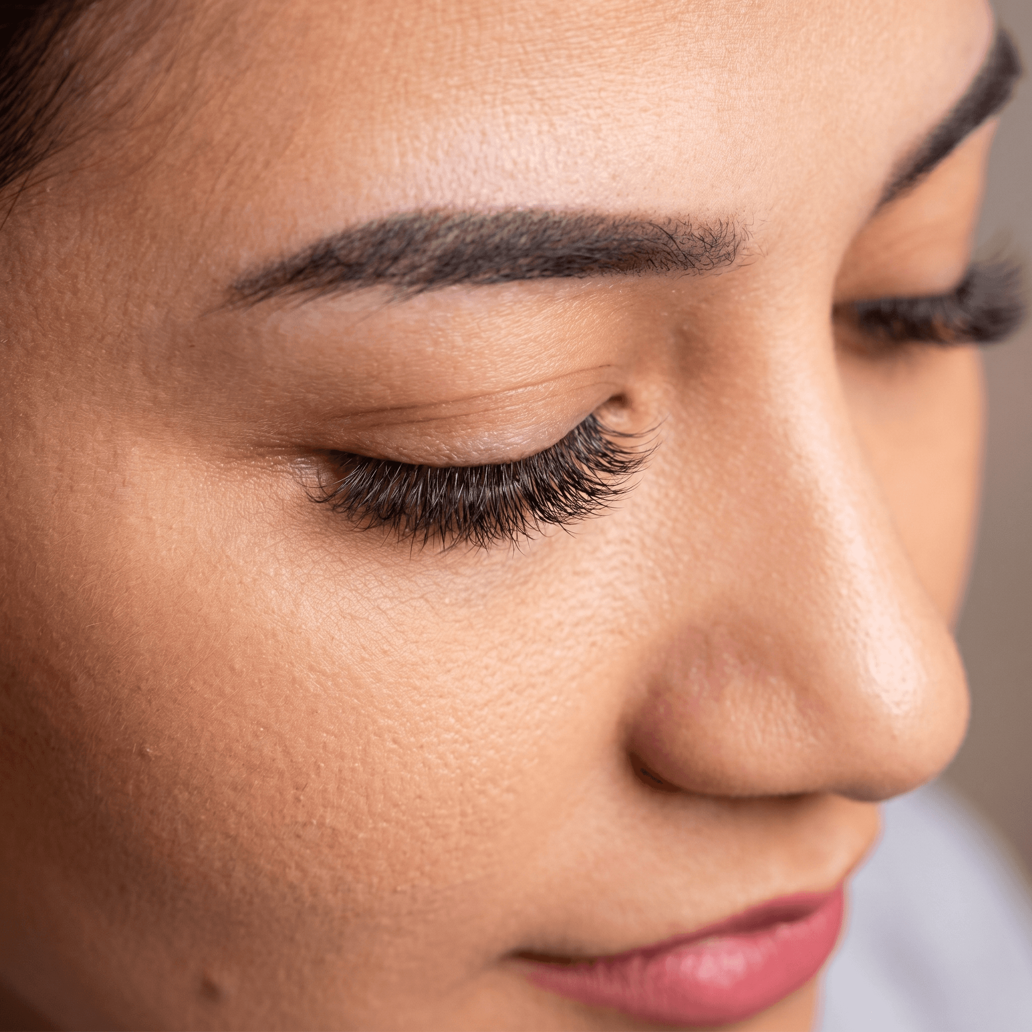 A close-up of soft, full lash extensions on a relaxed eye